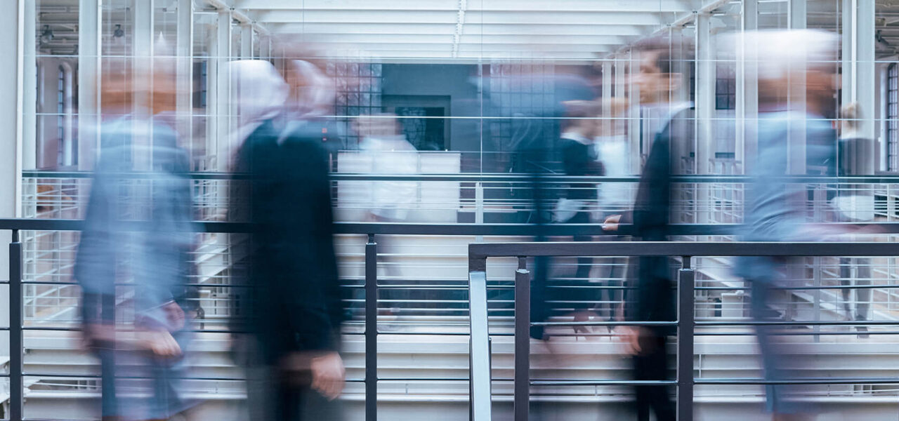 business-people-talking-in-corridor-PSVCLEM(1)